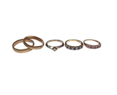 Five 9ct gold rings to include a diamond single stone ring, a sapphire and diamond eternity ring, a ruby and diamond eternity