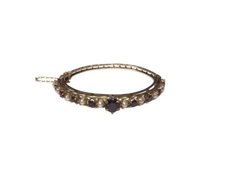 Victorian style 9ct gold garnet and cultured pearl hinged bangle, 17cm inner diameterWeight 15.5 grams