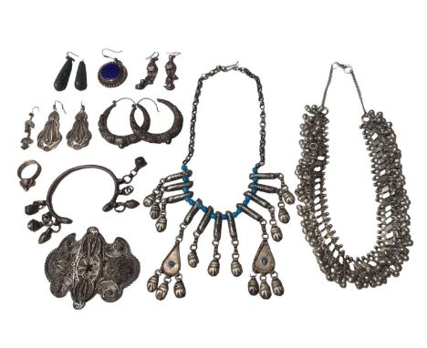 Group of Eastern and other white metal jewellery including two necklaces, a buckle, various earrings, a ring and a torque ban