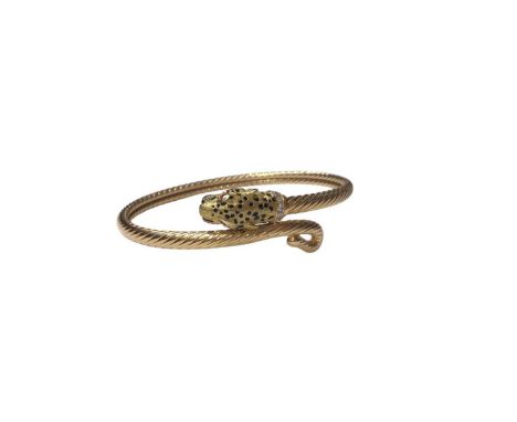 18ct gold torque bangle with leopard head terminal, black enamel spot decoration, a pair of ruby eyes and a diamond set colla
