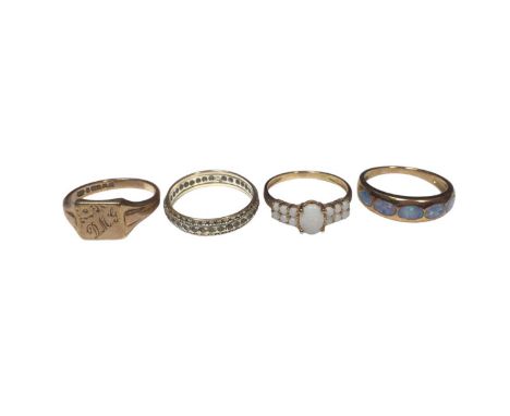 Four 9ct gold rings to include a signet ring, eternity ring and two opal/ opal doublet ringsTotal weight 9.9 grams