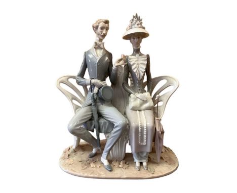 Lladro porcelain figure group - lovers on a bench, 30cm high