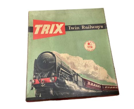 Trix Railway TTR, E. R. Passenger F24 set boxed, plus two Hornby Dublo coaches also boxed.
