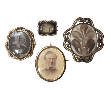 Four Georgian and later mourning and portrait miniature brooches including two with hairwork designs