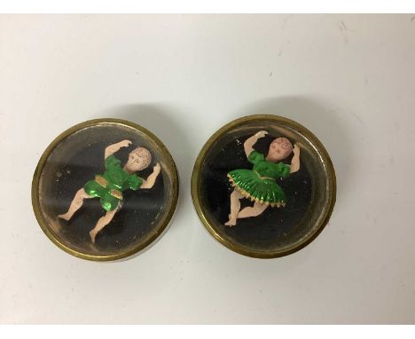 Victorian cuffs buttons including an unusual pair female and male dancers with green foil outfits, limbs and heads move. A si