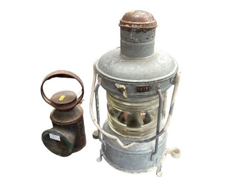A railway lantern and a ship's lantern, the larger measuring 50cm high