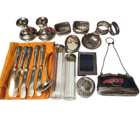 Group of silver items including pair of salts, pair of candlesticks, silver topped glass jars, miniature photograph frames, n