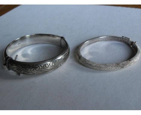 A .925 silver Links of London bangle, Edinburgh 2000 with a traditional silver bangle, Birmingham 1962 (2) 