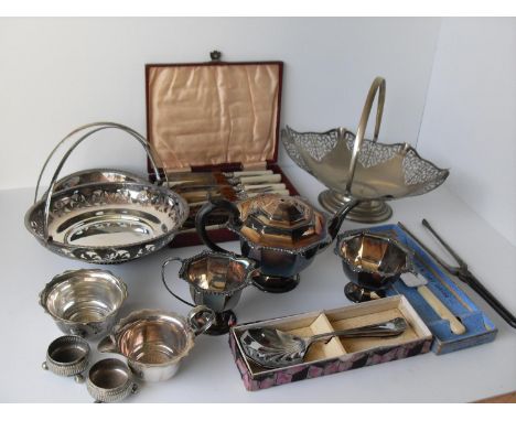 A selection of silver plated items to include three swing-handle baskets, tea service, cased fish knives / forks, a nurse's b