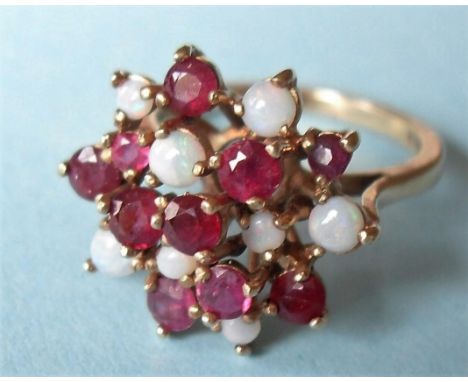 An opal and ruby cluster ring on 9ct gold wire gallery band, size N, 4 g 