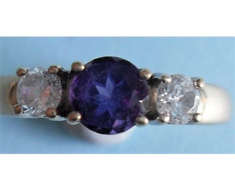 A 9ct yellow gold three-stone amethyst and cubic zirconium ring, size L, 2g 