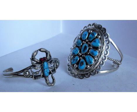 Two silver / turquoise-set Najavo cuff bangles, one signed Tommy Moore, sterling and a similar unsigned Najavo bracelet with 