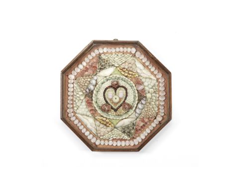 A SHELL-WORK SAILOR'S VALENTINE, BARBADIAN, 19TH CENTURY,the octagonal mahogany case mounted with geometric designs comprisin