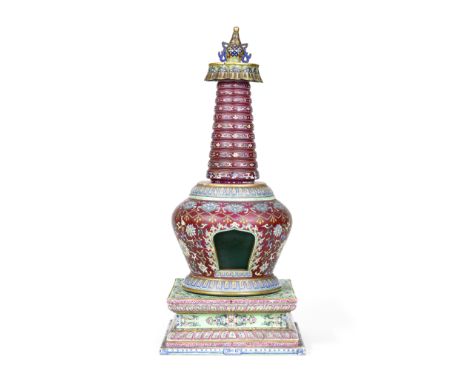 A RARE FAMILLE ROSE RUBY-RED-GROUND BUDDHIST STUPA18th century The shrine modelled with a shaped niche, finely decorated and 