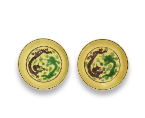 A PAIR OF SMALL GREEN AND AUBERGINE YELLOW-GROUND 'DRAGON' SAUCER-DISHESGuangxu six-character marks and of the periodEach dis