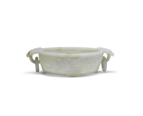 A RARE VERY PALE GREEN JADE 'BAJIXIANG' 'MARRIAGE' BOWLQianlongCrisply carved around the exterior with the 'Eight Buddhist Em