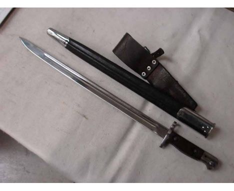 A British 1907 pattern Bayonet, indistinctly marked with coronet and signed Wilkinson 1907, 42cm single edge fullered blade, 