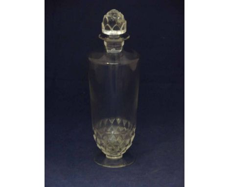 A Lalique clear glass decanter and stopper in a Pouilly style with artichoke decorated base and stopper, on clear circular fo
