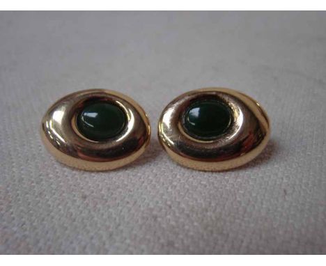 A pair of modern 18ct yellow gold earrings of oval form, each set with a single oval jade cabochon, 22.6g, total weight, each