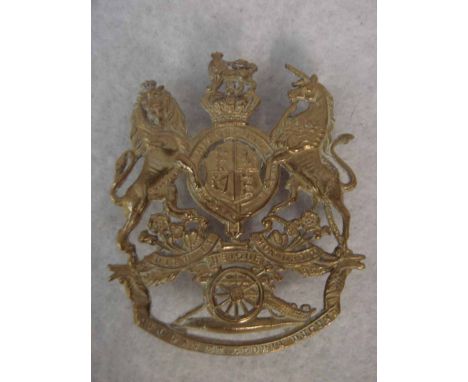 A Royal Artillery Helmet Plate for the Blue Cloth Helmet. Brass, Victoria crown with three rear lugs present. 