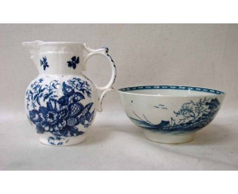 A late 18th century Caughley mask jug, transfer printed in under glaze blue with pinecones and flowers, moulded cabbage leaf 