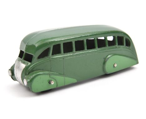 Dinky Toys Streamlined Bus (29b). In dark green with mid green side panels, black ridged wheels with black rubber tyres. VGC,