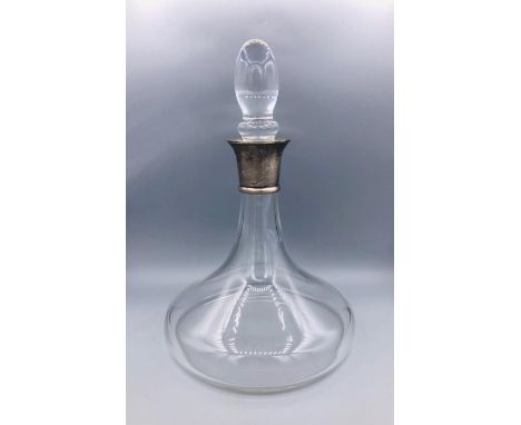 A silver necked ships decanter, hallmarked.