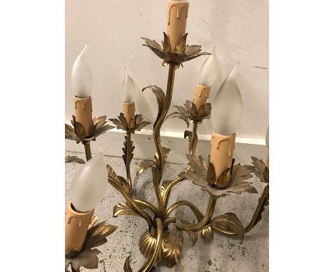 A seven arm lamp with leaf design