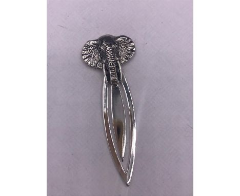 A silver bookmark with elephant finial