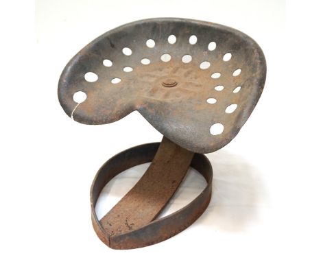 CAST IRON TRACTOR SEATnow mounted on a shaped metal stand