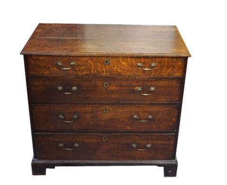 EARLY 19th CENTURY OAK CHESTwith a moulded top above four long graduated drawers, with brass plain curved handles, standing o