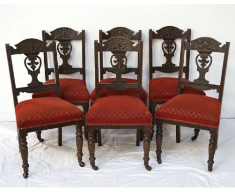 SET OF SIX EDWARDIAN MAHOGANY DINING CHAIRSthe shaped top rails with carved bow decoration above a central carved splat, with