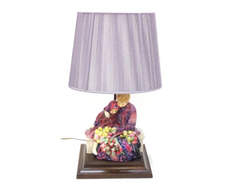 ROYAL DOULTON FIGURE GROUPThe Flowers Sellers Children, HN 1342, now mounted on a rectangular mahogany stepped base with lamp