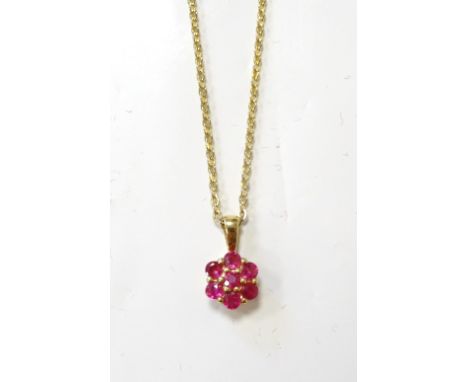 RUBY CLUSTER PENDANTon nine carat gold, on gilt chain