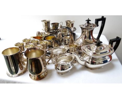 LOT OF SILVER PLATED WARESincluding a four piece tea service, cake basket, goblets, tankards, condiments and preserve pot