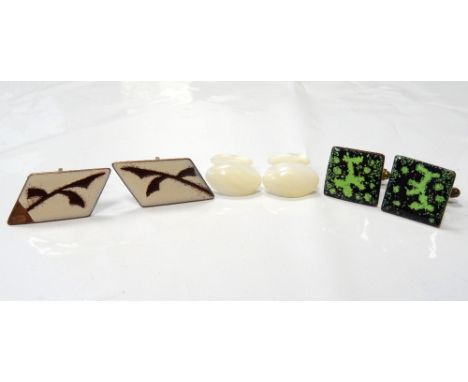 THREE PAIRS OF CUFFLINKScomprising a mother of pearl pair and two pairs with enamel decoration