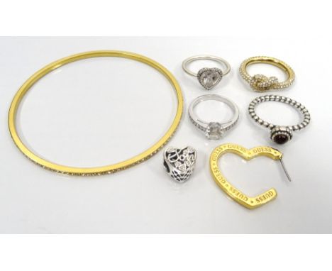 SELECTION OF FASHION JEWELLERYcomprising two Pandora gem set silver rings; a Pandora pierced heart Mother and Son charm; a Sw