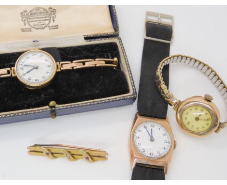 A 9ct gold ladies vintage wristwatch, weight including mechanism 15.7gms, two 9ct watch heads, weight with straps and mechani