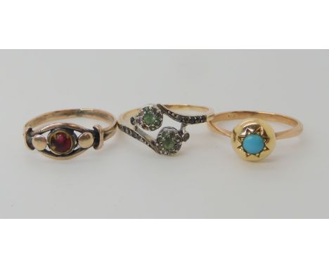 A 9ct turquoise set ring, size M1/2, a yellow metal double flower clear gem set  ring size R and a yellow metal ring set with