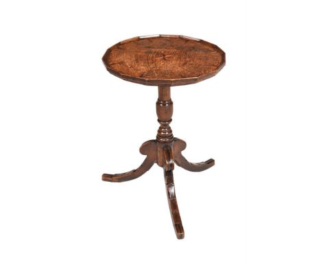 AN OAK AND INLAID TRIPOD TABLE EARLY 19TH CENTURY With stellar and spandrel inlay to the multi-facetted shaped top 64cm high,