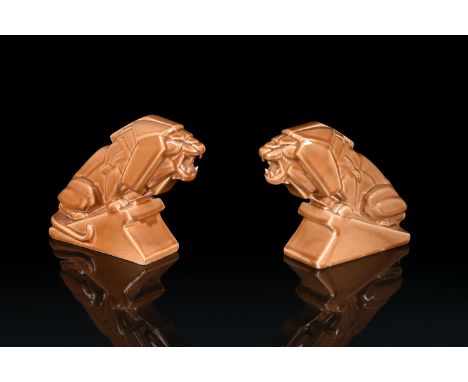 PERCY METCALFE (1896-1970), FOR ASHTEAD POTTERY, A PAIR OF ART DECO GLAZED EARTHENWARE MODELS OF LIONS 'LIONS OF INDUSTRY'SEC