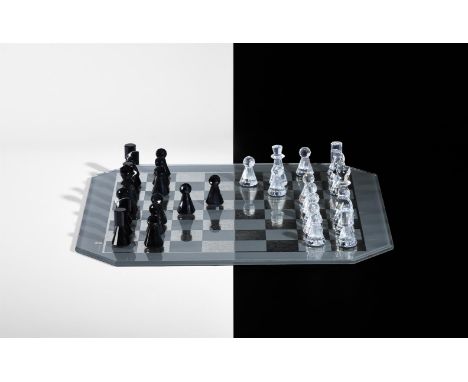 A MODERN SWAROVSKI GLASS CHESS SETComprising a cased set of chessmen and a boardThe board 34.5cm square Condition Report: Whi