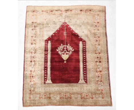 A GHIORDES RUG Approximately 168 x 122cmCondition Report: Signs of age, wear, use overall, some marks and staining to the sur