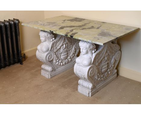 A LARGE VARIEGATED GREEN MARBLE SIDE OR CONSOLE TABLE OF RECENT MANUFACTUREThe marble top above carved marble addorsed winged