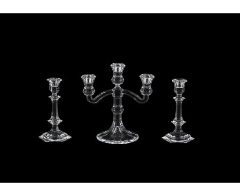 A PAIR OF BACCARAT HEXAGONAL SECTION COLUMNAR CANDLESTICKSMODERNAcid-etched stamps20cm highAnd a press-moulded glass three li