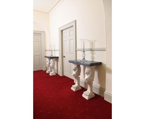 A PAIR OF MARBLE CONSOLE TABLES OF RECENT MANUFACTUREWith Marmo Portoro tops on carved white lion monopodia supports Each 76c