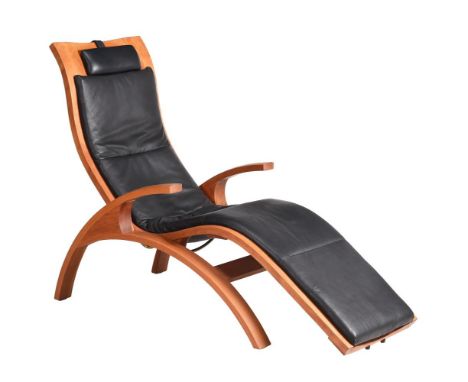 THOMAS MOSER, CHAISE, A CHERRY AND BLACK LEATHER UPHOLSTERED RECLINING ARMCHAIRDATED 2005With simple action, the underside wi