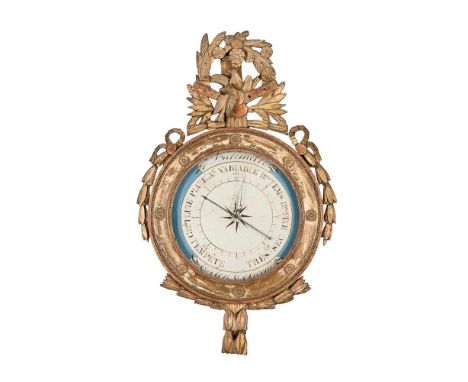 A FRENCH GILTWOOD FRAMED BAROMETER 19TH CENTURY The case with trophy surmount and trailing festoons, the painted dial with th