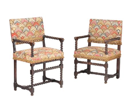 A NEAR PAIR OF CARVED OAK AND TAPESTRY UPHOLSTERED ARMCHAIRSSECOND HALF 17TH CENTURY104 and 96cm high respectively Condition 