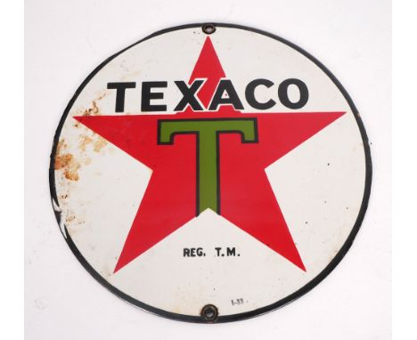 1930s Texaco motor spirit enamel sign. A circular, single-sided, enamel sign from a petrol pump. The white ground with the Te